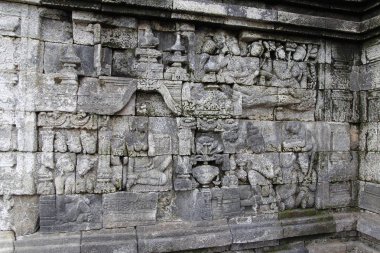Güzel kısma duvar dekorasyonu Borobudur Tapınağı, Yogyakarta, Endonezya taşa oyulmuş 