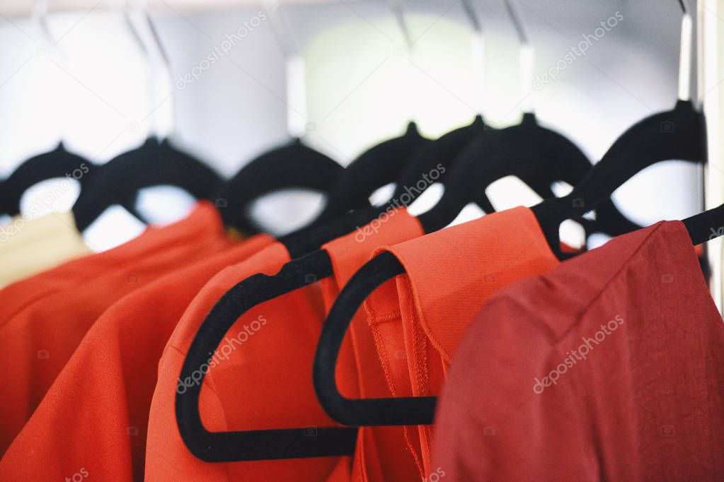 Women clothing on hangers in a boutique store