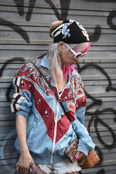 Milan, Italy - September 19, 2018: Street style outfits before JIL SANDER fashion show during Milan Fashion Week.