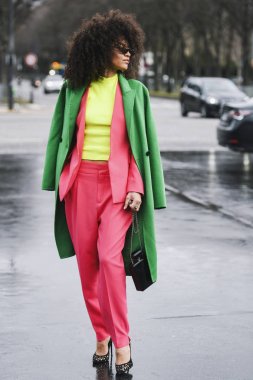 Paris, France - March 05, 2019: Street style outfit before a fashion show during Milan Fashion Week - PFWFW19 clipart
