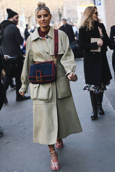 Milan, Italy - February 21, 2019: Street style Woman wearing a Fendi handbag before a fashion show during Milan Fashion Week - MFWFW19