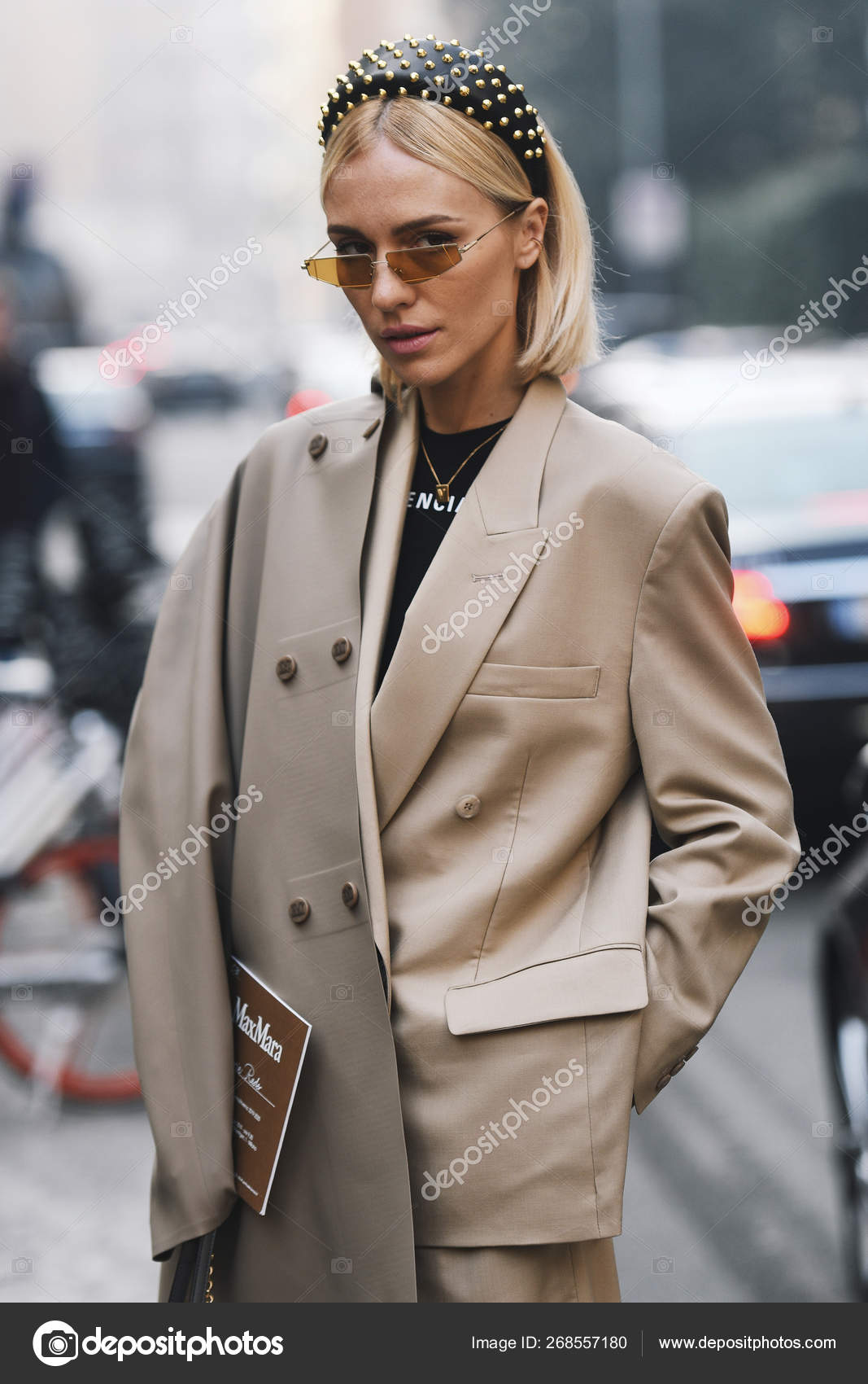 MILAN, ITALY - SEPTEMBER 22, 2019: Woman with beige Louis Vuitton shawl  before Boss fashion show, Milan Fashion Week street style Stock Photo -  Alamy
