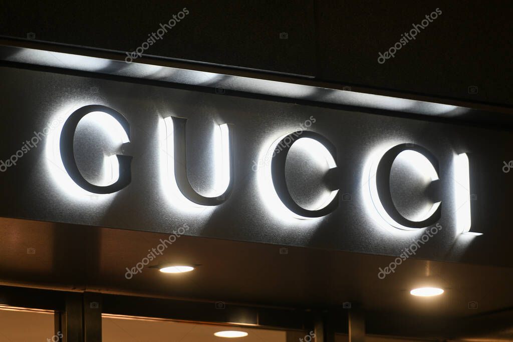 Milan, Italy - January 13, 2020: Gucci store lighted logo detail