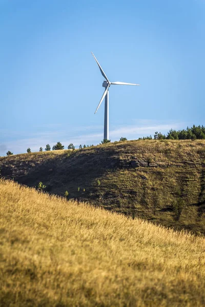 Wind turbines on a hill — Stock Photo, Image