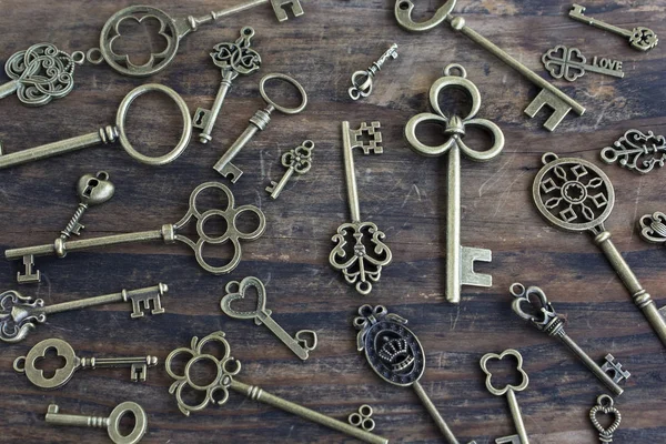 Vintage Keys on Rustic Wooden Background
