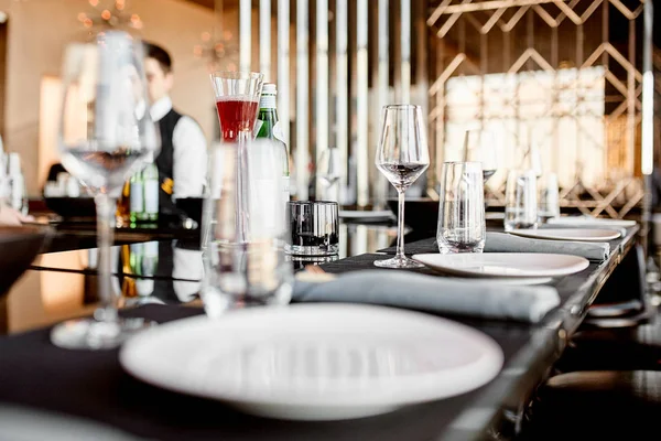 Photo of glass and plates with on the table — Stock Photo, Image