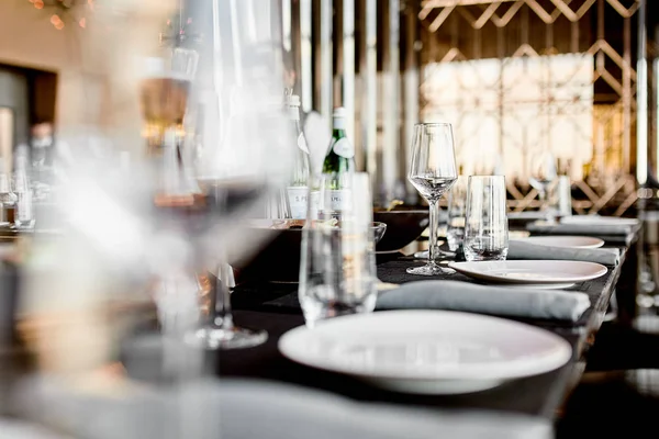 Empty glasses on the table and light table setting — Stock Photo, Image