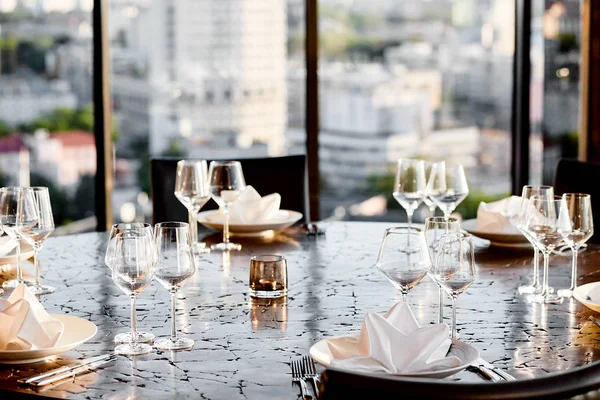 empty glasses and table setting with a beautiful background in a restaurant