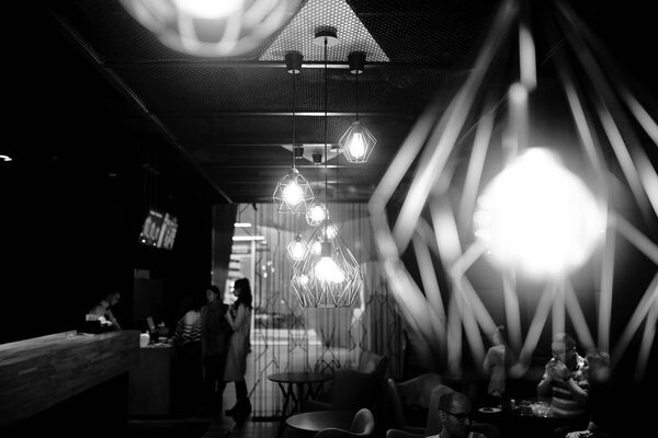 black and white photo with designer lamps 