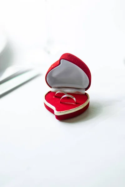 Wedding rings in a red heart-shaped box — Stock Photo, Image