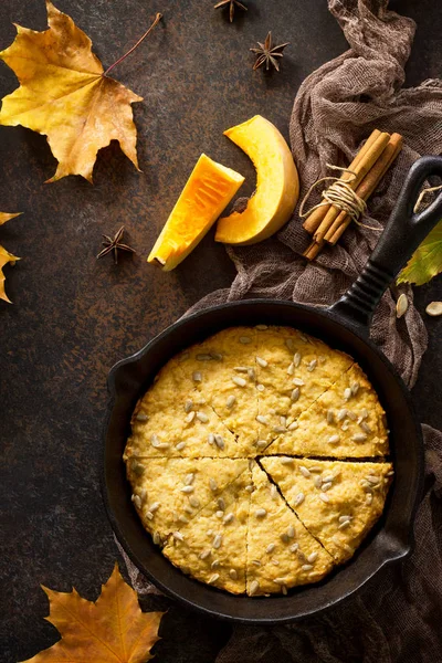 Traditional English cuisine. Breakfast table with pumpkin scones on a kitchen wooden table. Top view flat lay background.