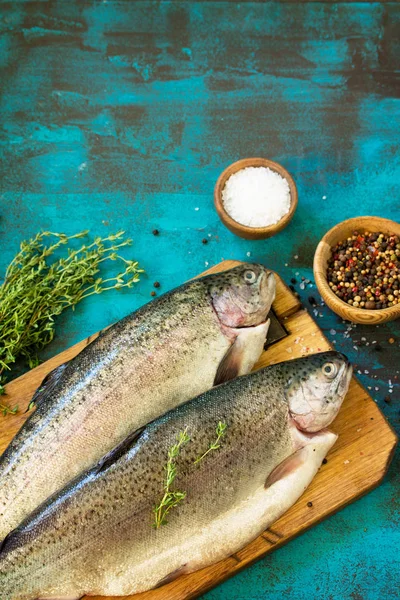 Fresh Fish. Raw Salmon and Spice on a blue slate table. Top view flat lay background. Copy space.