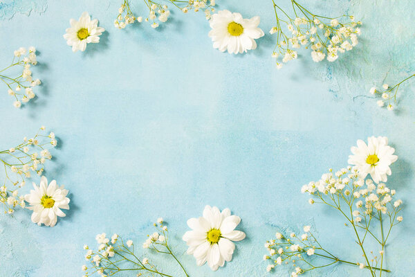 Easter background with spring flowers. Top view flat lay background with.