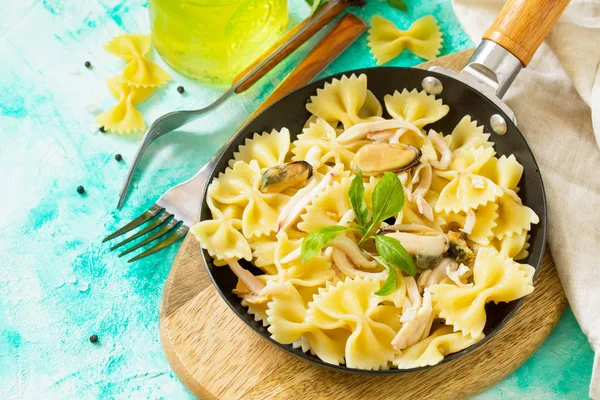 Pasta Farfalle with seafood on stone table. Vegetarian  seafood pasta. Diet menu. Copy space.