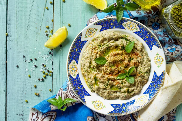 Arabic cuisine. Fresh homemade creamy mung hummus with spicy, fa