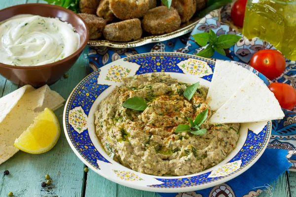 Arabic cuisine. Fresh homemade creamy mung hummus with spicy, fa