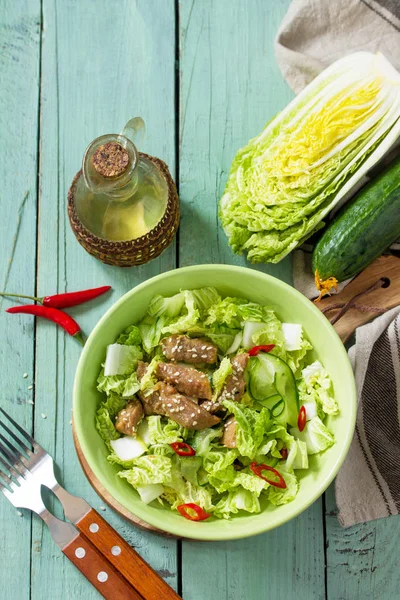 Diet menu. Healthy salad with Chinese cabbage, chicken, sesame a
