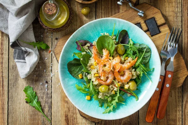 Diet menu, Vegan food. Healthy salad with quinoa, arugula, Shrim