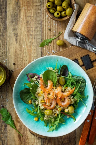 Diet menu, Vegan food. Healthy salad with quinoa, arugula, Shrim