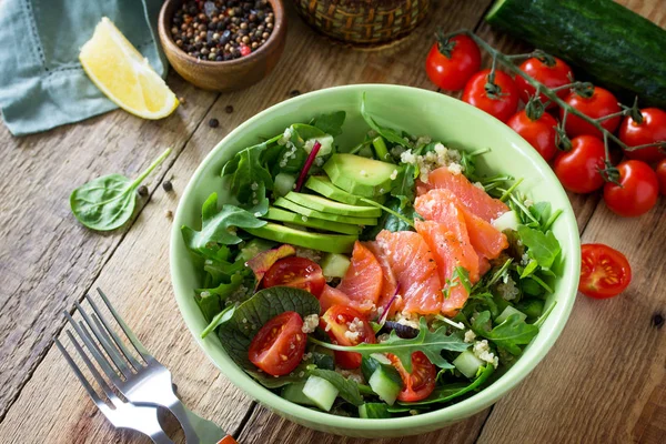 Diet menu, Vegan food. Healthy salad with quinoa, arugula, Tomat