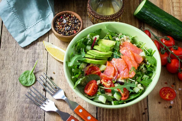 Diet menu, Vegan food. Healthy salad with quinoa, arugula, Tomat
