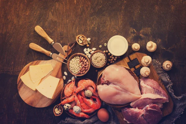 Balanced food background. Protein foods on a rustic wooden backg — Stock Photo, Image