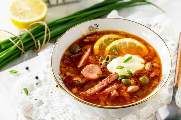 Traditional Russian soup Solyanka with meat, sausages, vegetable — Stock Image Traditional Russian soup Solyanka with meat, sausages, vegetable Stock Photo