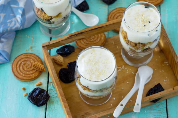 Vegan Dessert with whipped cream, nuts, oatmeal, prunes and sesa