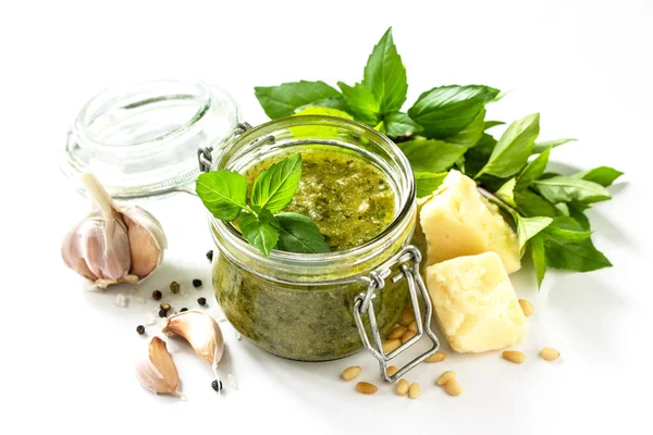 Healthy Italian cuisine. Green pesto sauce isolated on a white b — Stock Photo, Image