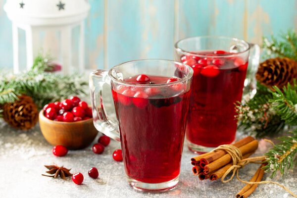 Christmas drinks. Hot winter drink with cranberries and cinnamon