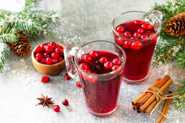 Christmas drinks. Hot winter drink with cranberries and cinnamon