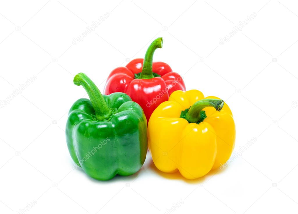 fresh vegetable bell peppers in three colored red, green, yellow like reggae color style isolated on white background