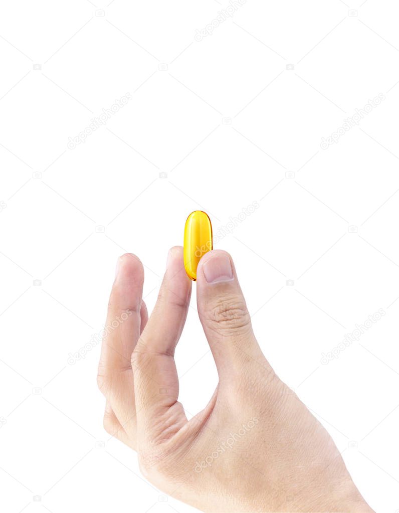 Fish oil soft gel supplement capsule source of omega and vitamins in hold hand isolated on white background