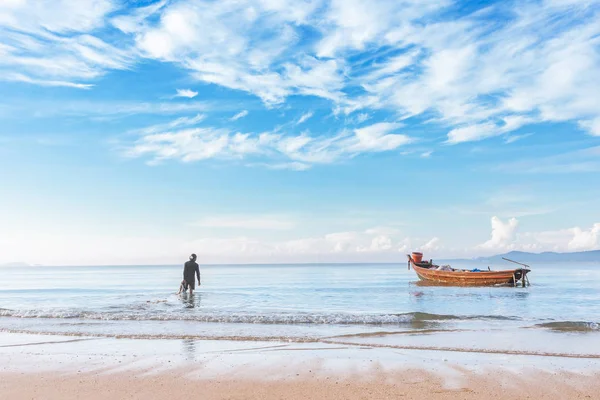 stock image beautiful beach in morning sunrise and cloudy blue sky with fisherman boat