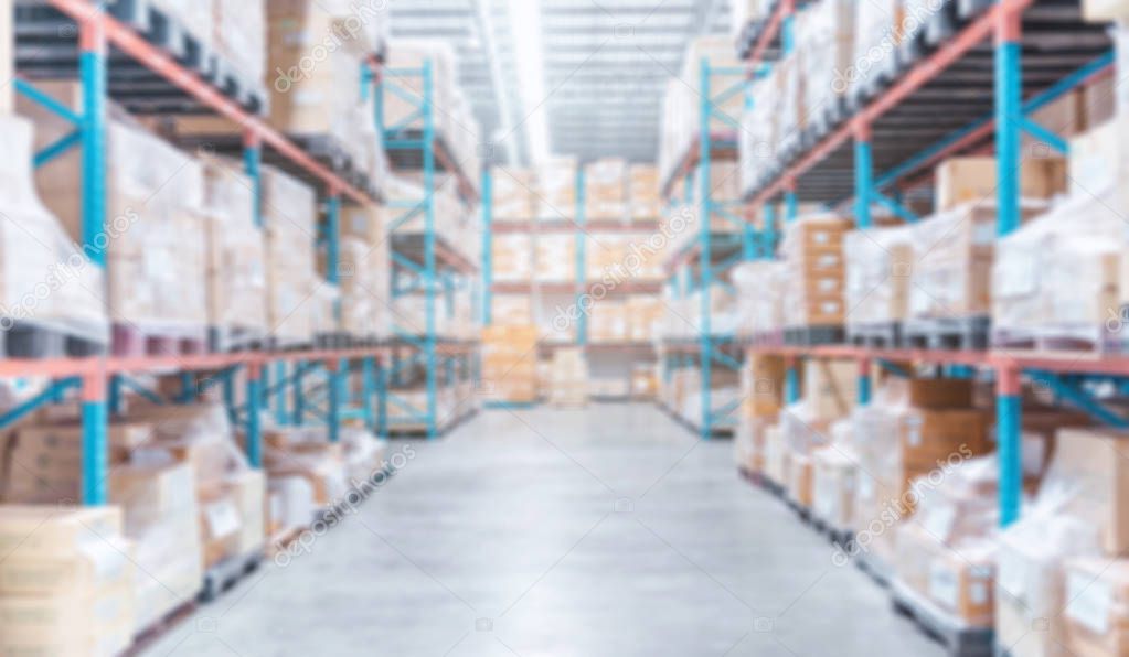 blurred warehouse inventory product stock with container stack for logistic business background, warehouse interior background