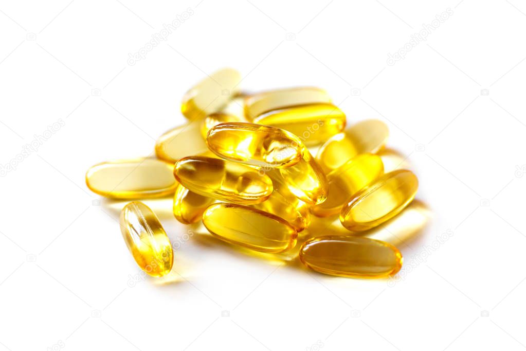 fish oil supplement capsules higher vitamin and omega-3 in selective focus isolated on white background