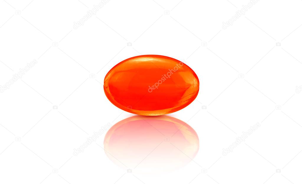 Red supplement soft gel capsule isolated on white background