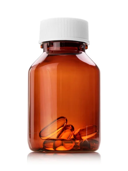 Fish oil soft gel capsules in brown transparen plastic bottle — Stock Photo, Image