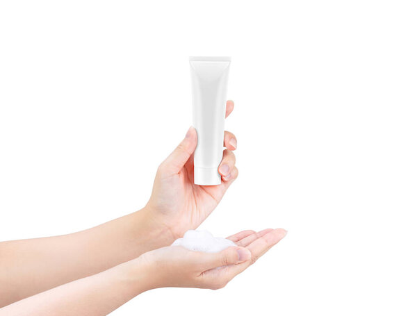 Presented Hands holding blank cosmetic white tube and whip facial foam for face cleansing isolated on white background