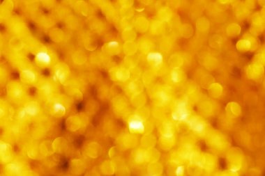 Altın rengi arka plan bulanık odak bokeh için şablon ışık ile