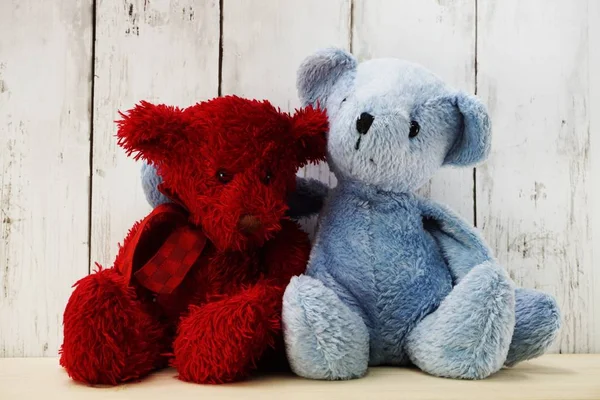 red and blue teddy bear hugging each other love and relationship concept