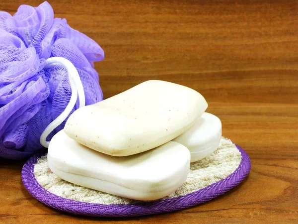 White Soap Plastic Bath Puff Wooden Background — Stock Photo, Image