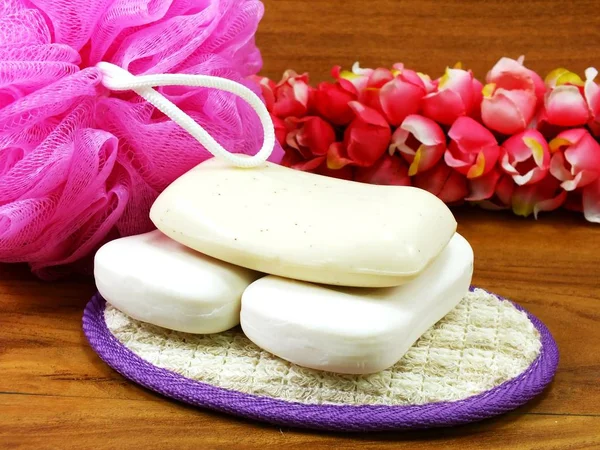 White Soap Plastic Bath Puff Wooden Background — Stock Photo, Image