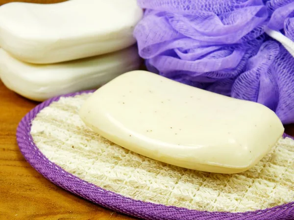 White Soap Plastic Bath Puff Wooden Background — Stock Photo, Image