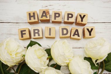 Mutlu Cuma kelime ışık kutusu ahşap arka plan üzerinde çiçek buketi ile