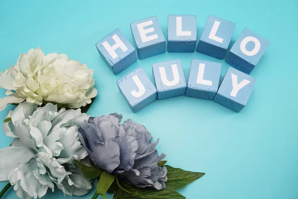 hello July alphabet letter on blue background