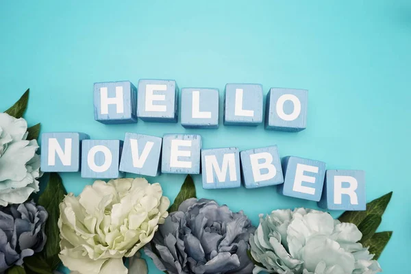 hello November alphabet letter on blue background