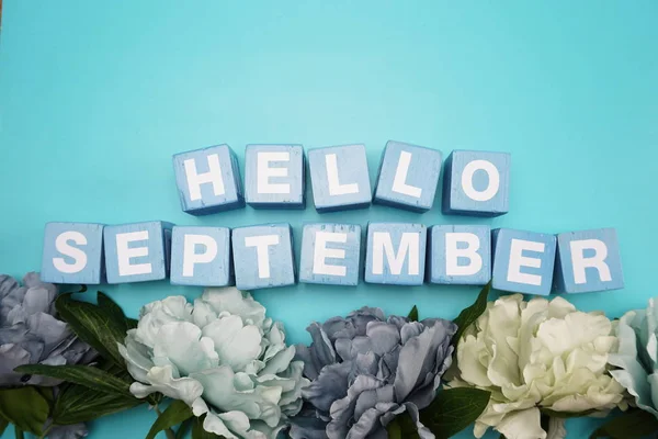 hello September alphabet letter on blue background