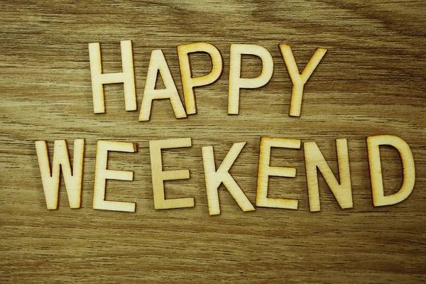 Happy Weekend text message on wooden background