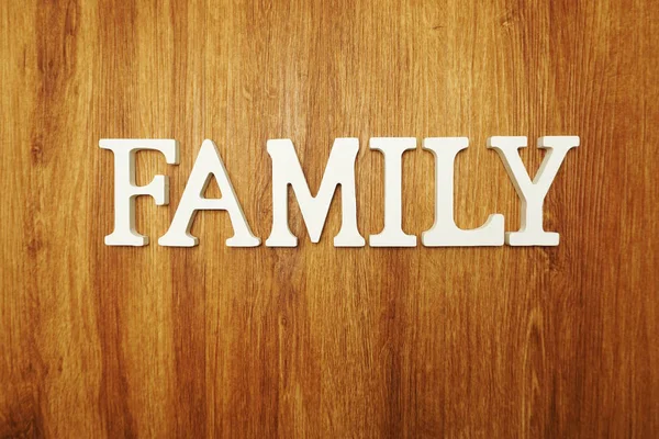 Rodzina Słowo Litery Alfabetu Drewnianym Tle — Zdjęcie stockowe
